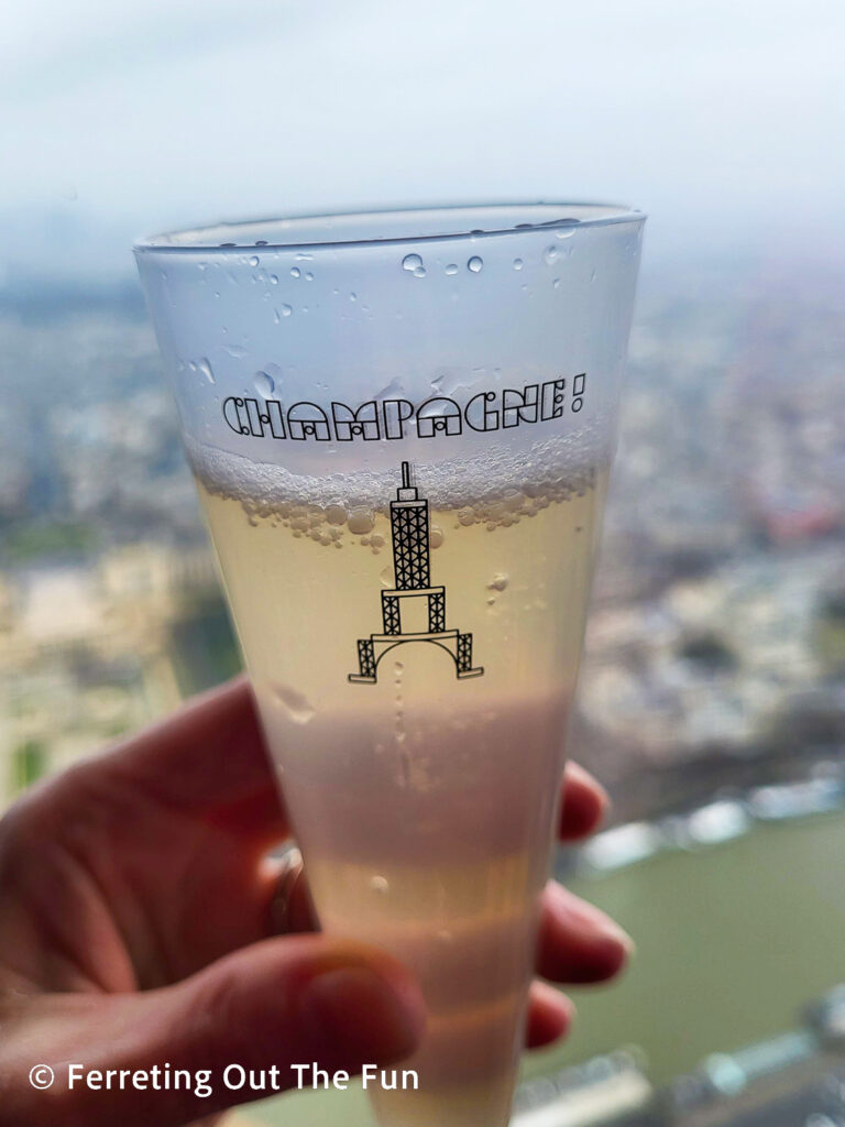 Sipping champagne at the top of the Eiffel Tower in Paris