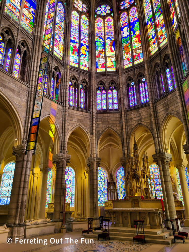 Beautiful stained glass windows illuminate the Basilica Cathedral of Saint Denis in Paris. This abbey church is the first masterpiece of Gothic architecture.