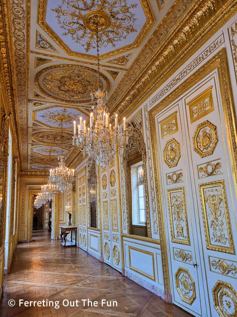 Gilded hallway with chandeliers in Hotel de la Marine Paris