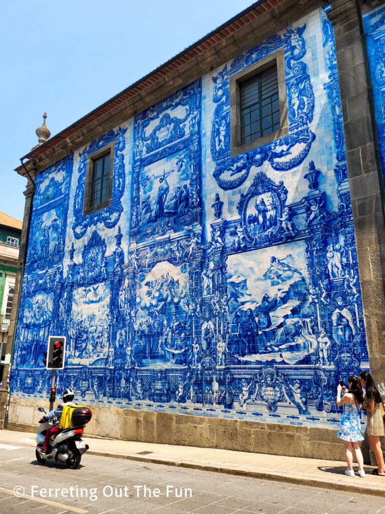 Blue and white azujelos cover the facade of the Chapel of Souls church in Porto