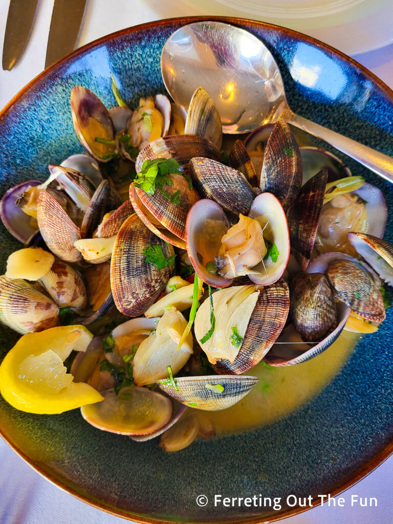 Portuguese clams with white wine, lemon, garlic, cilantro, lemongrass, and chili pepper flakes