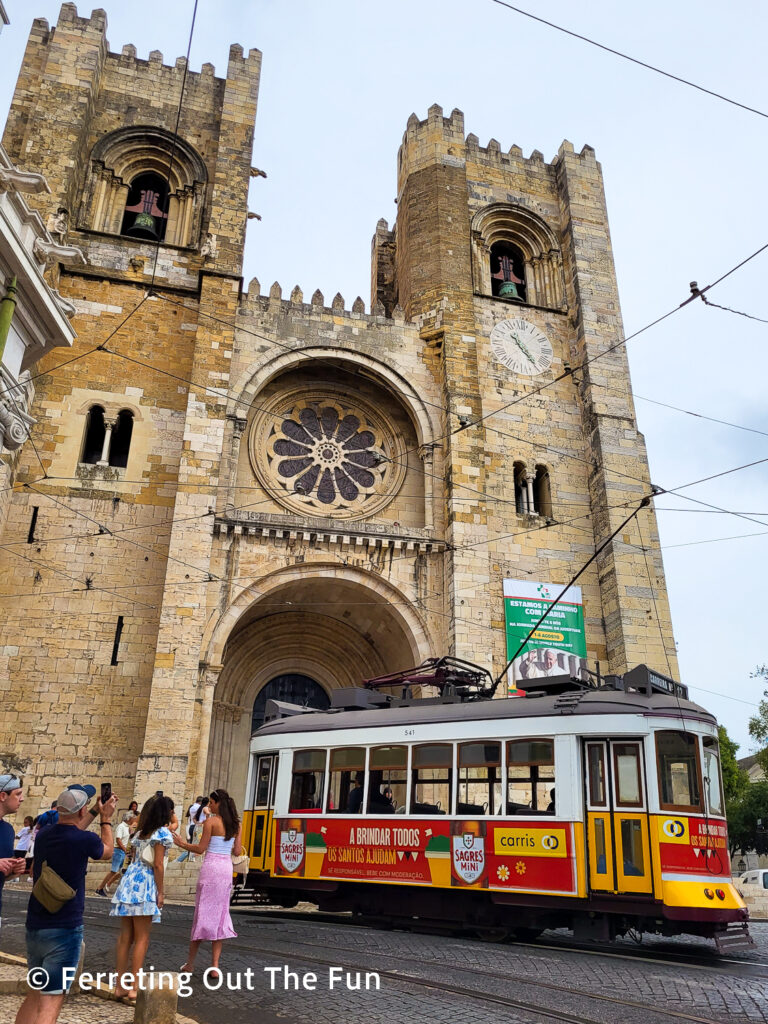 Tram 28 passes by Lisbon Cathedral in Alfama