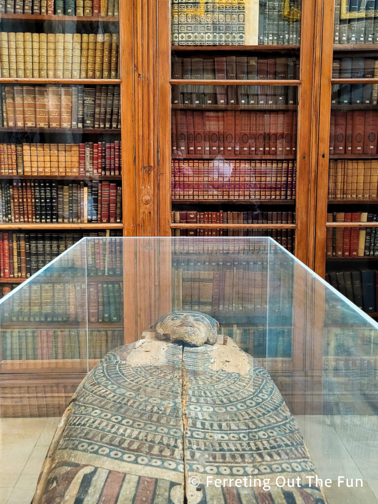 Egyptian sarcophagus and ancient books in the Carmo Convent Archeology Museum, Lisbon