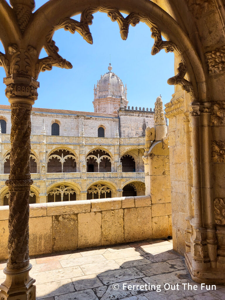 Ornately carved arches decorate the cloister of Jeronimos Monastery, Lisbon