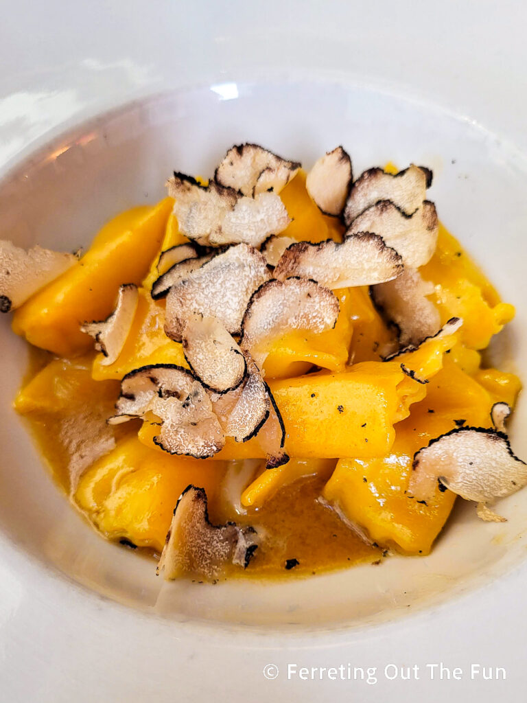 ravioli in a Parmigiano broth with shaved white truffle at Ristorante Gallo d'Oro in Parma Italy