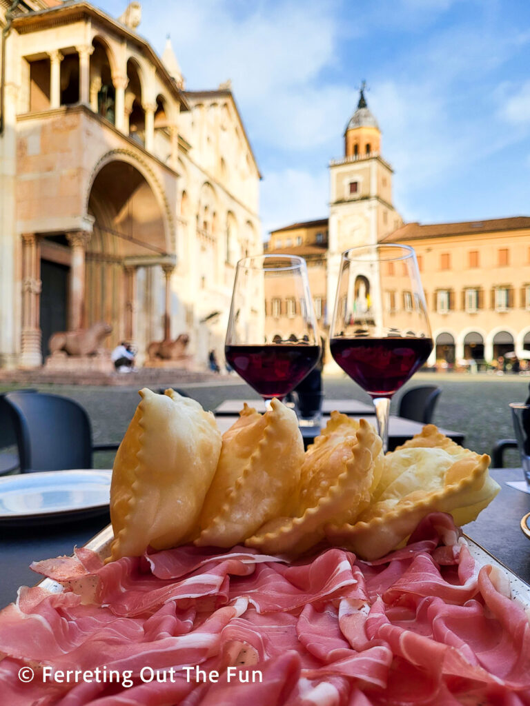 Gnocco fritto, or proscuito and puffed bread, with red wine from Enoteca Al Duomo, a great wine bar in Modena's Piazza Grande.