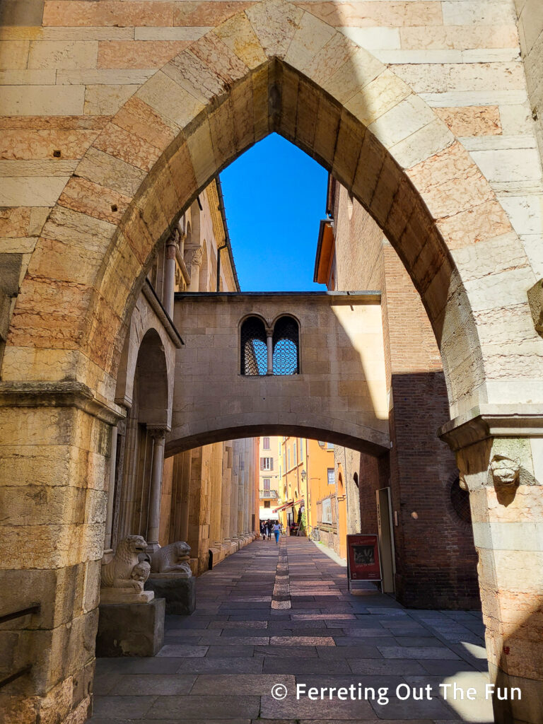 Arched entrance to a medieval laneway in Modena Italy