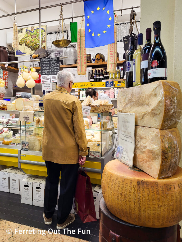 Cheese and wine shop in Mercato Storico Albinelli, the fabulous covered market in Modena Italy