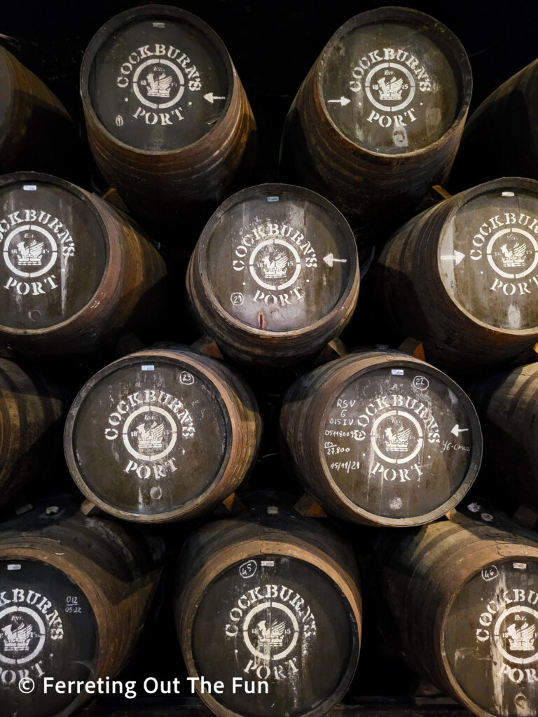 Barrels of Cockburns Port stacked in the cellar in Porto, Portugal