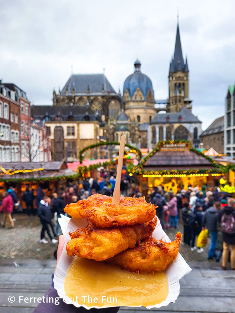 Delicious reibekuchen, or potato pancakes with applesauce, at the Aachen Christmas Market in Germany