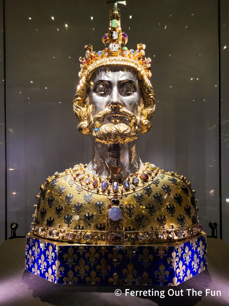 Bust of Charlemagne, a gold and silver reliquary covered in jewels. It hold a portion of the emperor's skull and is located in the Aachen Cathedral Treasury.