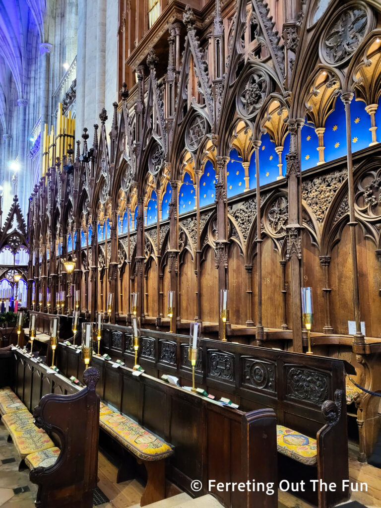 Ornately carved choir stalls inside medieval Winchester Cathedral