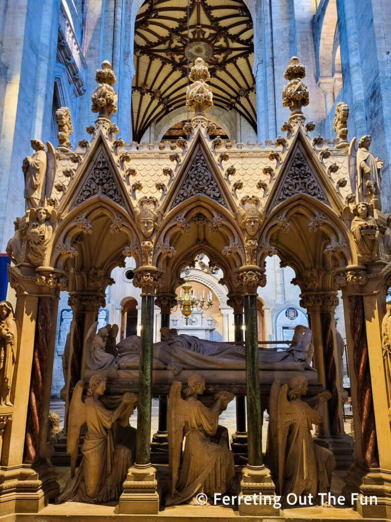 Elaborate tomb with kneeling angels inside Winchester Cathedral
