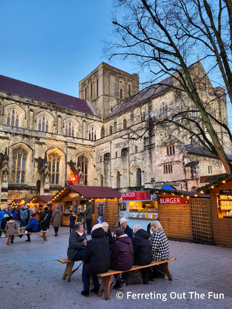 Winchester Cathedral Christmas Market food court with picnic tables and benches