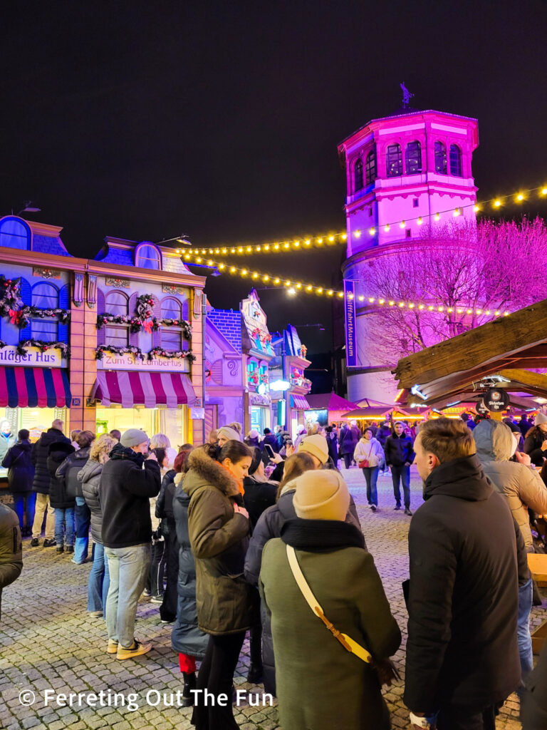 People lining up for food at the Burgplatz Christmas market in Düsseldorf Germany